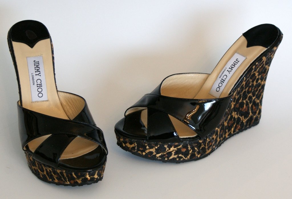 JIMMY CHOO WEDGE SLIDE - LEOPARD & BLK PAT - SZ 8: SHIMMERY SUMMER SLIDE - Black patent single-band upper with shimmery leopard-print covered wedge. DETAILS: 4.75 inch wedge tapers to .75 platform. New with original box and dust bag. SIZE 7.5 (38) PRI