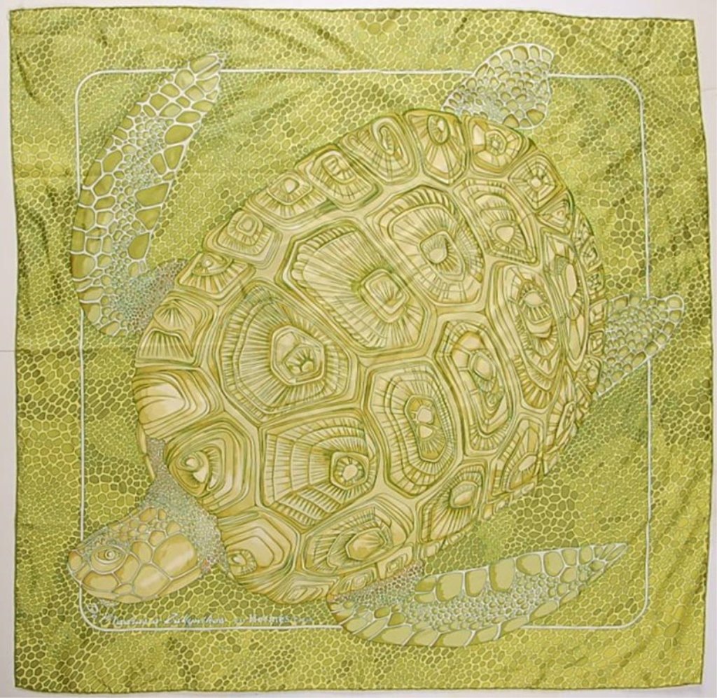 HERMÈS SILK SCARF WITH A SEA TURTLE MOTIF: Signed 'De Mardras à Zakynthos par Hermès Paris.' Absinthe green sea turtle scarf in 100 percent silk. Retains it's original 'Hermes Paris' tag. Measures 35 inches square. New, never worn.