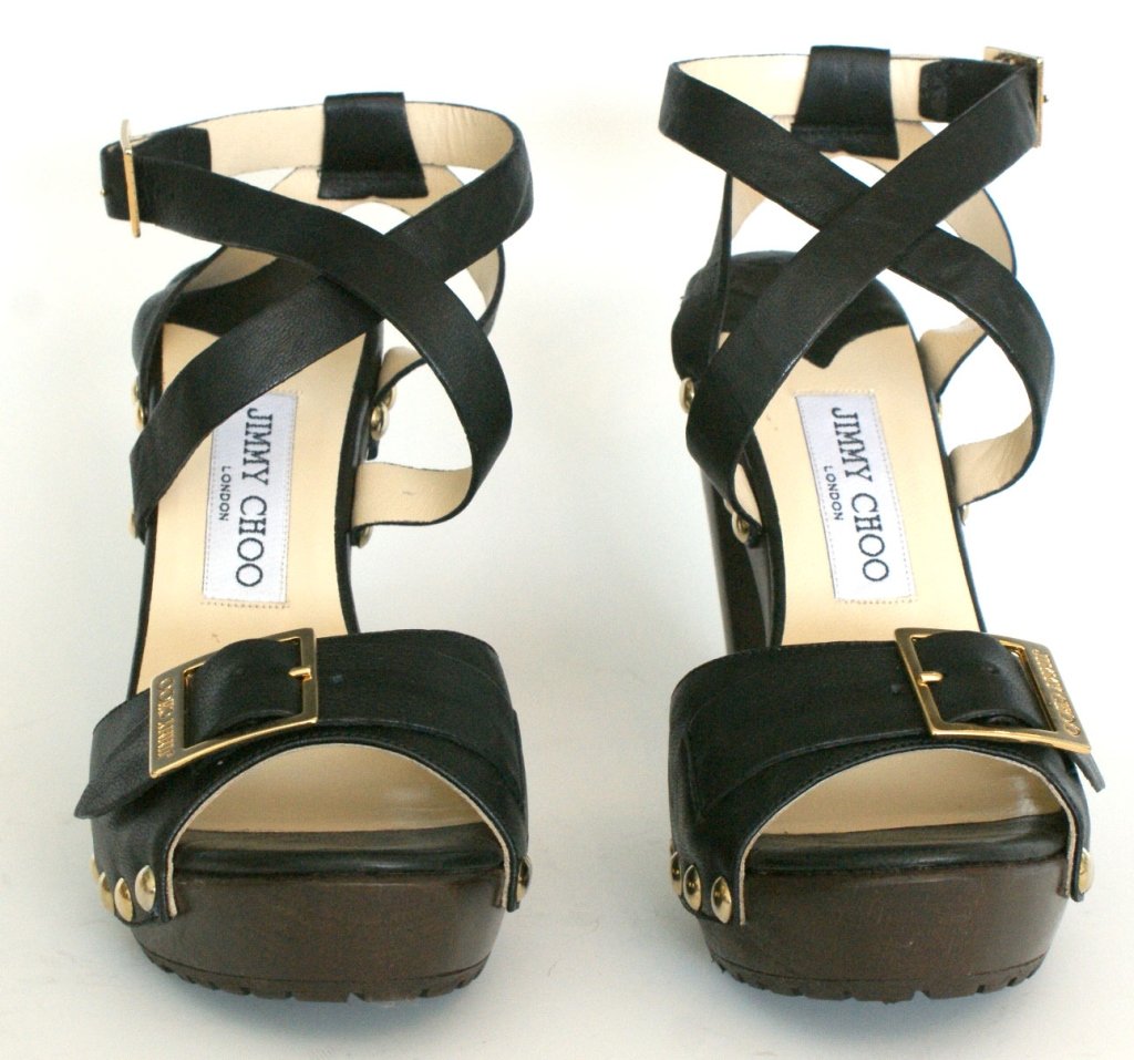 JIMMY CHOO UNCANNY CLOG SANDAL, SZ 7.5: Clog sandal heels in 'biker leather black' with metal studs and criss-cross ankle straps. Includes original box and dust bag. One inch platform with 4 inch heel, size 7 (37.5). New, never worn.