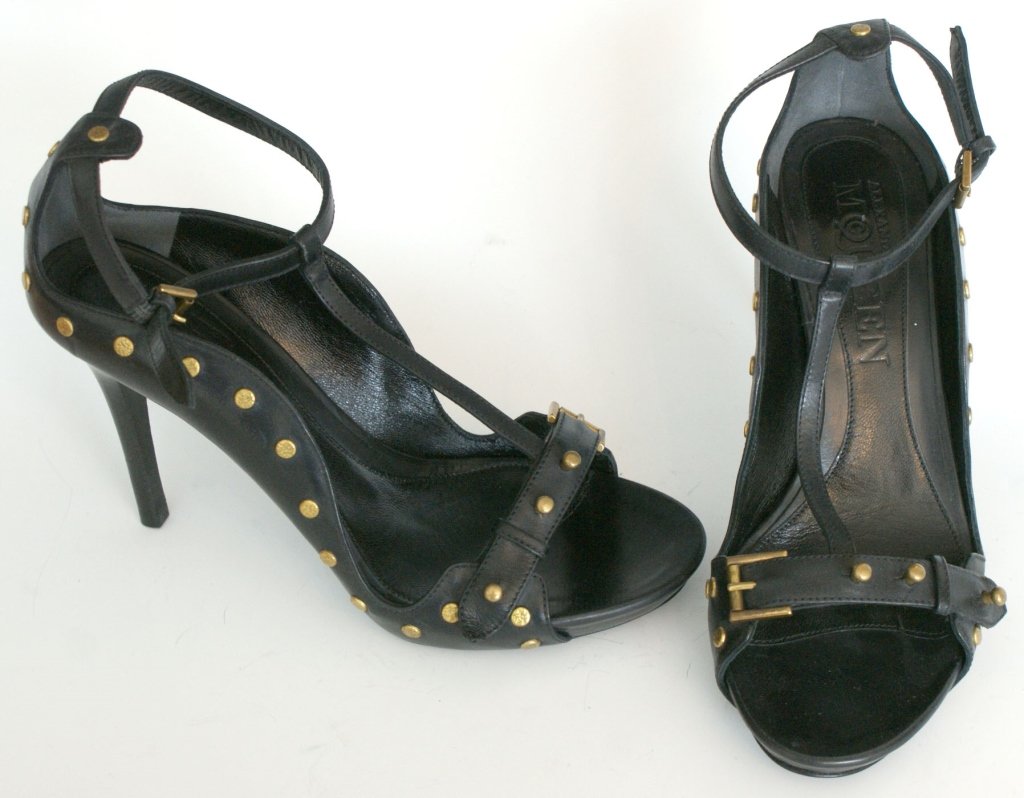 ALEXANDER McQUEEN STUDDED LEATHER SANDALS, SZ 7: T-strap sandal with stiletto heel, gold etched studs and wavy sides, leather upper, gold buckle hardware, original box and dust bag. Size 7 (37.5) with heel height of 3.5 inches with a slight toe plat