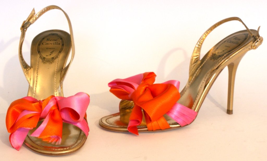 RENE CAOVILLA SATIN BOW STILLETTOS, RUNWAY, SZ 7.5: Gold slingback sandals with mandarin and magenta satin bows, stiletto heel, glittered sole. New, worn once on the catwalk. Original box and dust bag. Size 7 (37.5) with heel height of 3.75 inches.