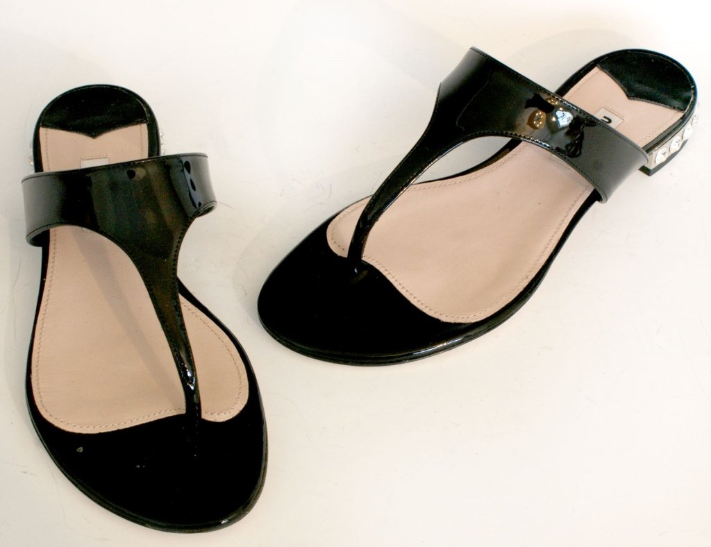 MIU MIU VERNICE BLACK PATENT SANDALS, SZ 6.5: Black patent flip-flop sandals with crystals in the heels, all leather, original box and dust bag. Size 6.5 (37) with heel height of.75 of an inch. New, never worn.