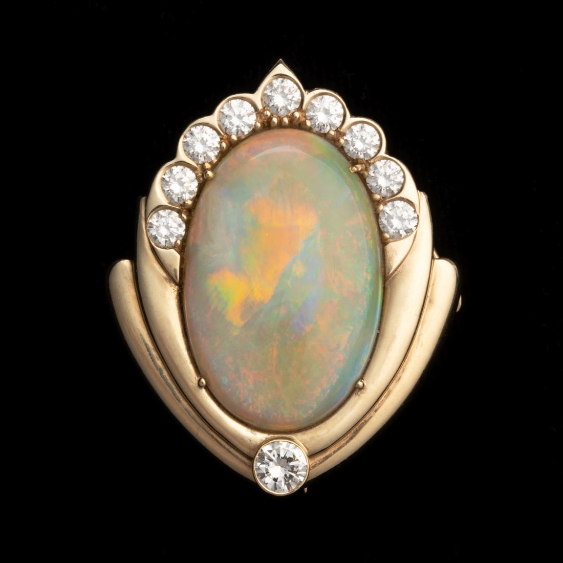 A GOLD AND DIAMOND PIN WITH SEVEN CARAT AUSTRALIAN OPAL: The shield motif 14k gold mounting is set with natural diamonds surrounding an outstanding Australian opal measuring 22.6 x 14.92 millimeters, displayed in a convertible brooch that can also be worn a