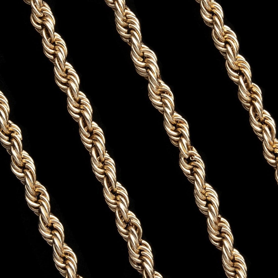 A MATINEE LENGTH 14 KARAT GOLD ROPE CHAIN (1 of 7)
