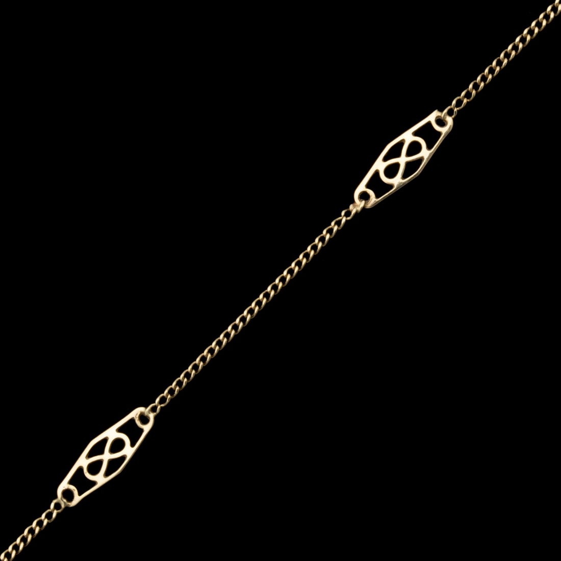 A 14K GOLD MATINEE LENGTH BAR LINK GOLD CHAIN: The station link chain with filigree plaques spaced evenly throughout is stamped 14K Italy. Necklace measures 24.5 inches with a total weight of 3.6 grams. Without proof of exemption, be aware that in