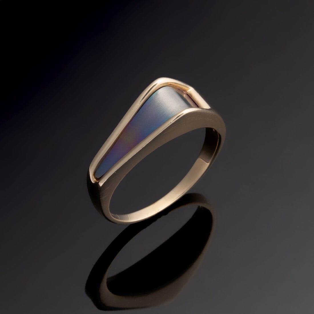 A 14K GOLD LADIES' MODERN FASHION RING: The modern design is set with what appears to be oxidized stainless steel and marked 14K. Ring size is 7.25. Weight is 4.3 grams. Without proof of exemption, be aware that internet sales tax applies t