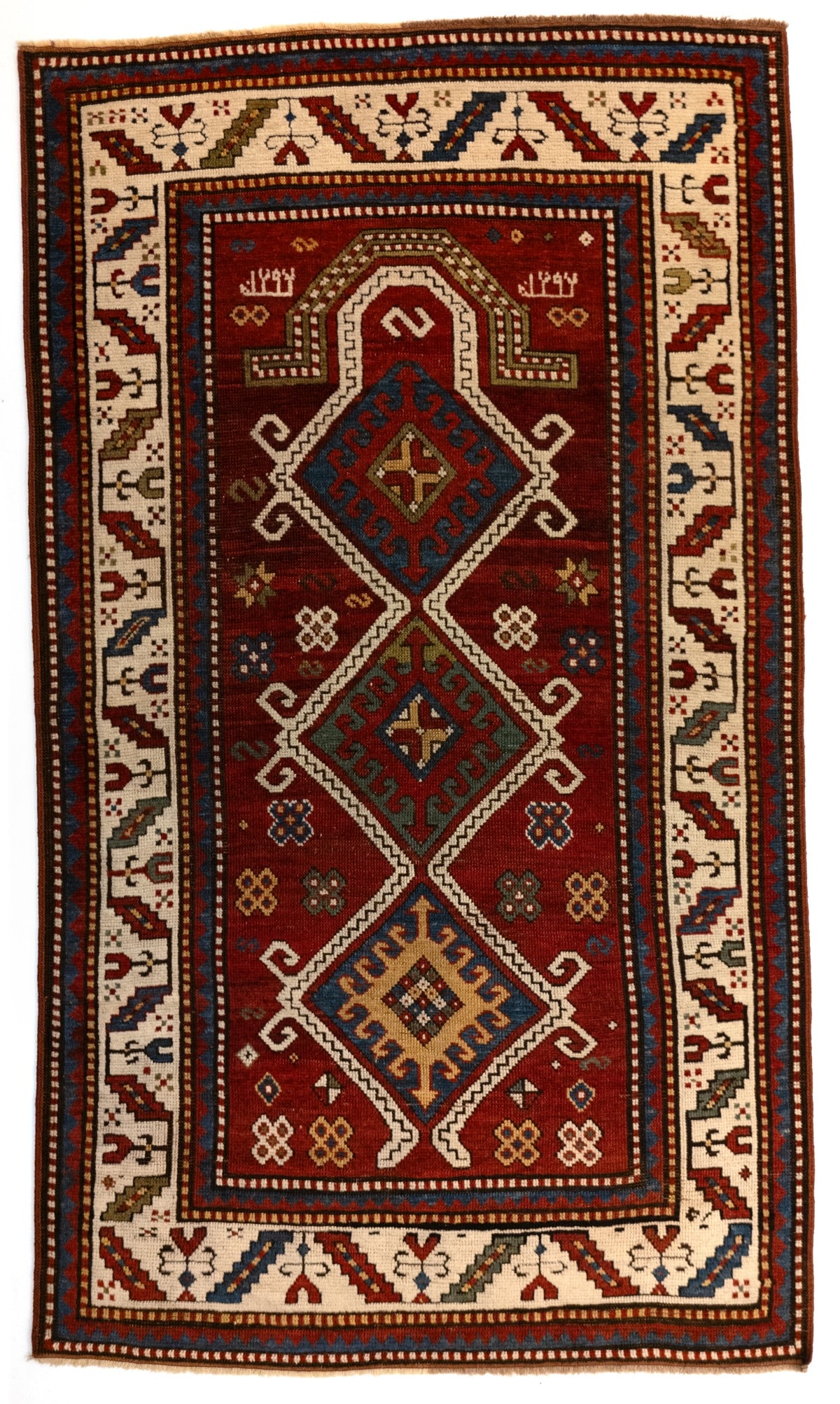 A KAZAK PRAYER RUG, DATED AH 1294 / AD 1877 (1 of 16)