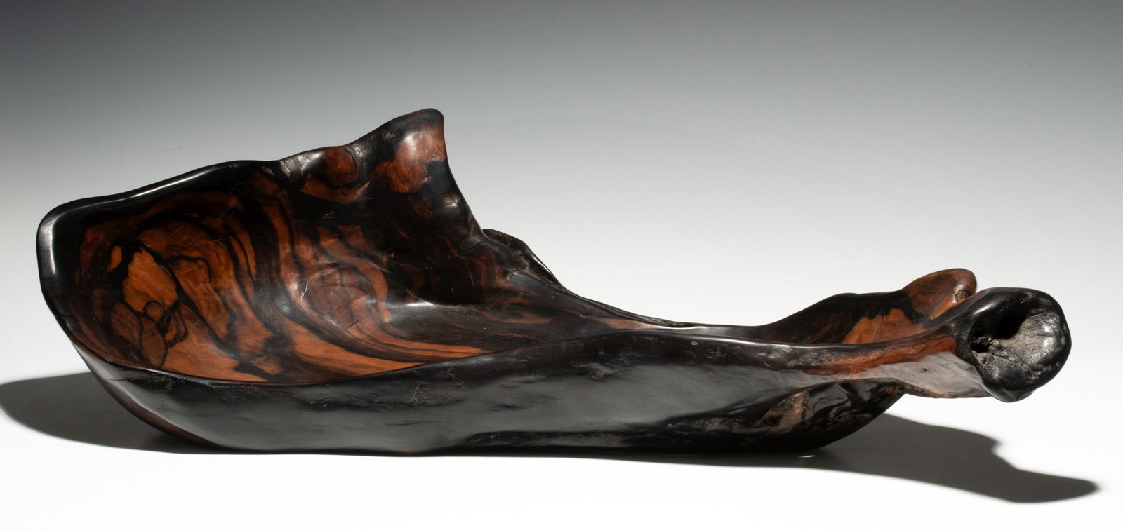 A LARGE AND HIGHLY FIGURED JAPANESE ROOT WOOD OKIMONO: Measures 7.5 x 27.75 x 10.25 inches. Provenance: The estate of John Adair Jr. (1942-2025), founder and proprietor of Kurofune Antiques, Tokyo (est. 1978). A world-renowned destination for Japanese bas