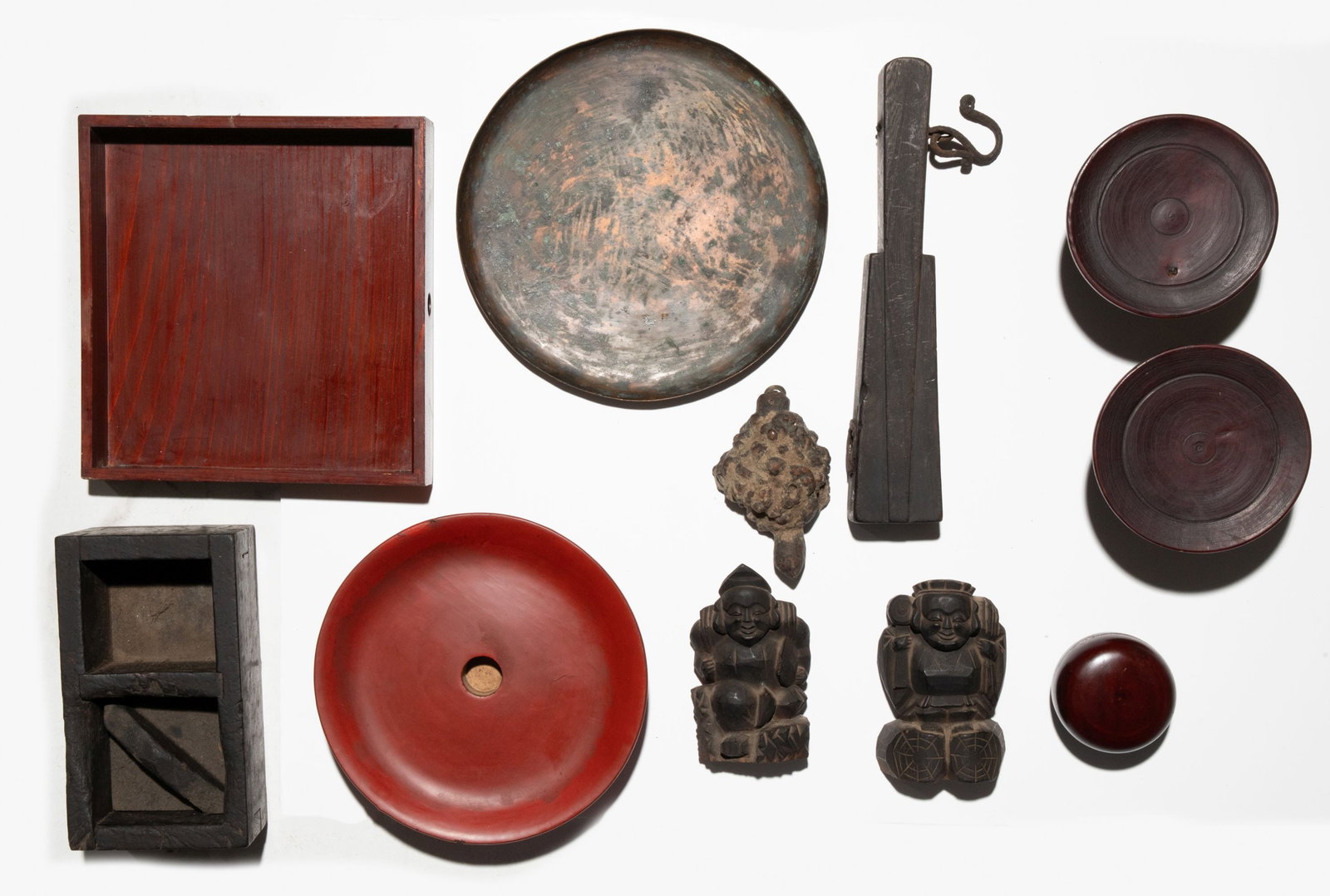 A COLLECTION OF CARVED WOOD & OTHER JAPANESE ARTIFACTS: The entire lot as shown. Sizes range from 2.25 to 12.5 inches in length. Provenance: The estate of John Adair Jr. (1942-2025), founder and proprietor of Kurofune Antiques, Tokyo (est. 1978). A world-r