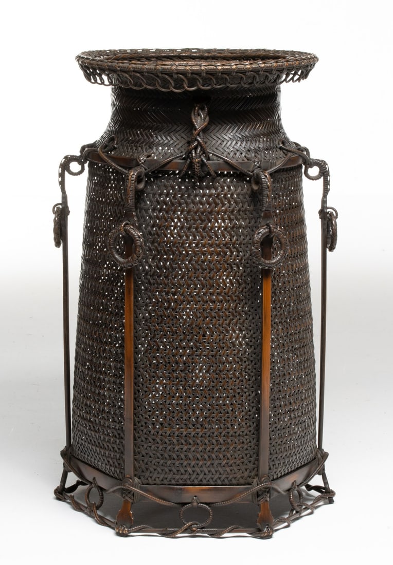 AN ELABORATE JAPANESE BASKET SIGNED SHOUN, ADAIR ESTATE: The outstanding example attributed to Ishikawa Shoun (1895-1973) features a tall, slightly tapered body skillfully woven in a complex twill weave and segmented by vertical reinforcing stays, each boun