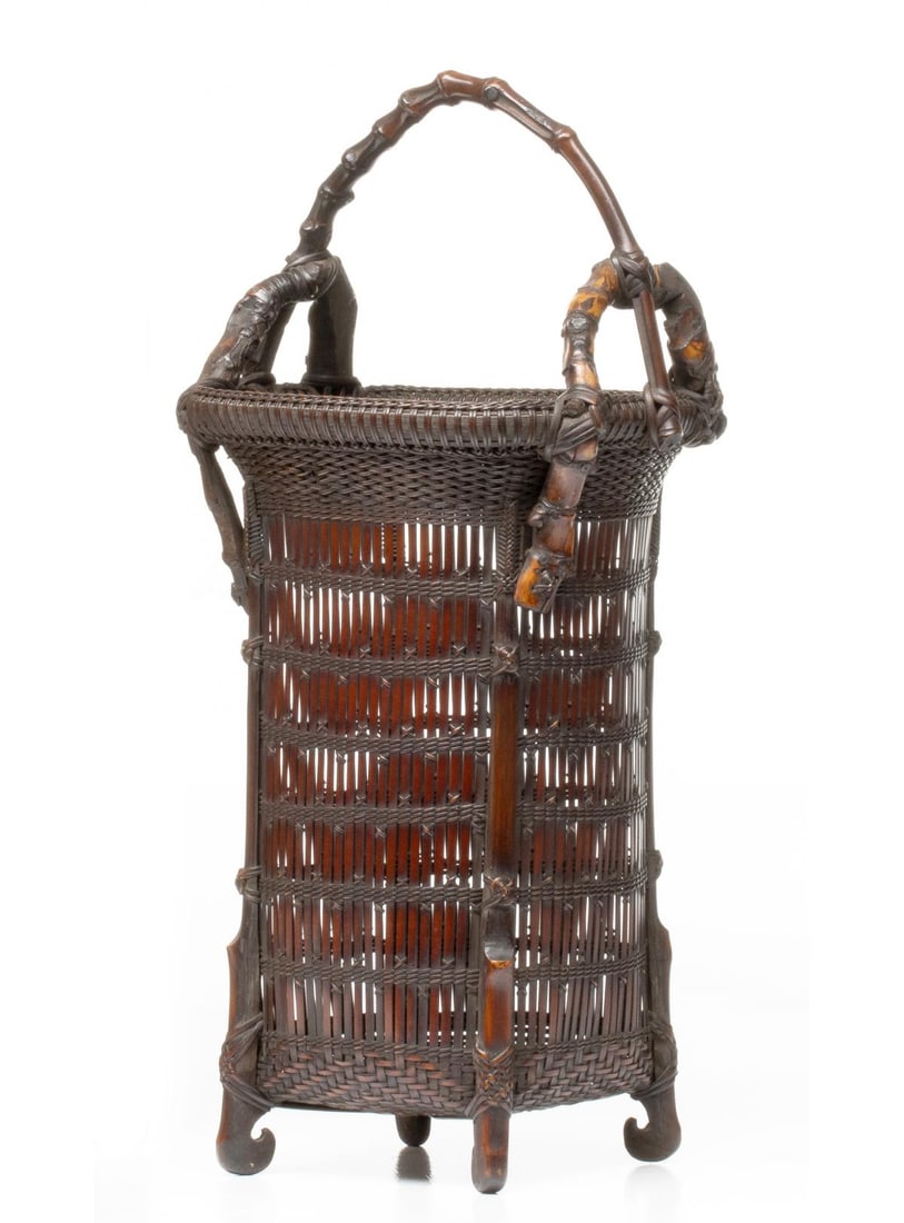 AN OUTSTANDING CHIKUBOSAI JAPANESE BASKET, ADAIR ESTATE: The extraordinary example of elegant rectangular form is finely constructed in straight, precisely-spaced vertical bamboo slats anchored by tightly wrapped bands of double-twined cord plaiting. The fo