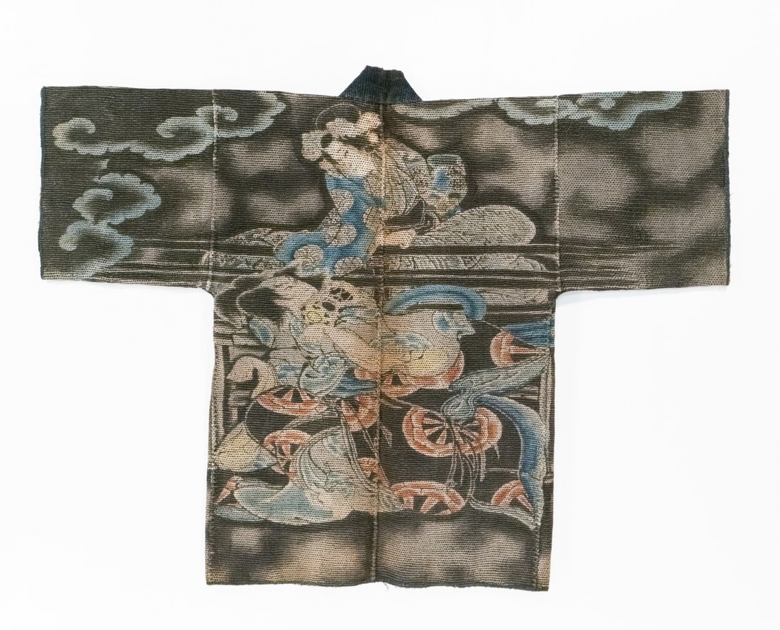 AN ELABORATE JAPANESE FIREMAN'S COAT, ADAIR ESTATE: The rare 19th century 'firefighter's' coat, made by hand stitching together multiple layers of loomed cotton fabric using thousands of sashiko stitches, features mythological figures among auspicious