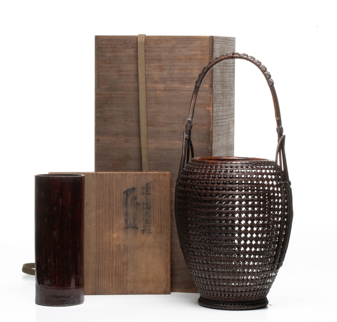 TANABE CHIKUUNSAI BASKET WITH TOMOBAKO, ADAIR ESTATE: The statuesque honeycomb mesh basket features a tall, swelling ovoid body that tapers to a skillfully wrapped pedestal foot. The skillfully woven hexagonal weave creates a dense and striking mesh
