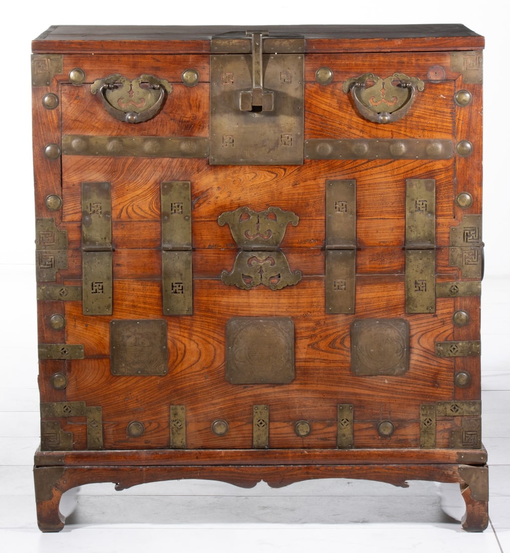 A 19TH CENTURY KOREAN BRASS BOUND CABINET: With dovetailing along the top corner of each side and good patina. Measures 44 x 39.5 x 20 inches. Provenance: The estate of John Adair Jr. (1942-2025), founder and proprietor of Kurofune Antiques in