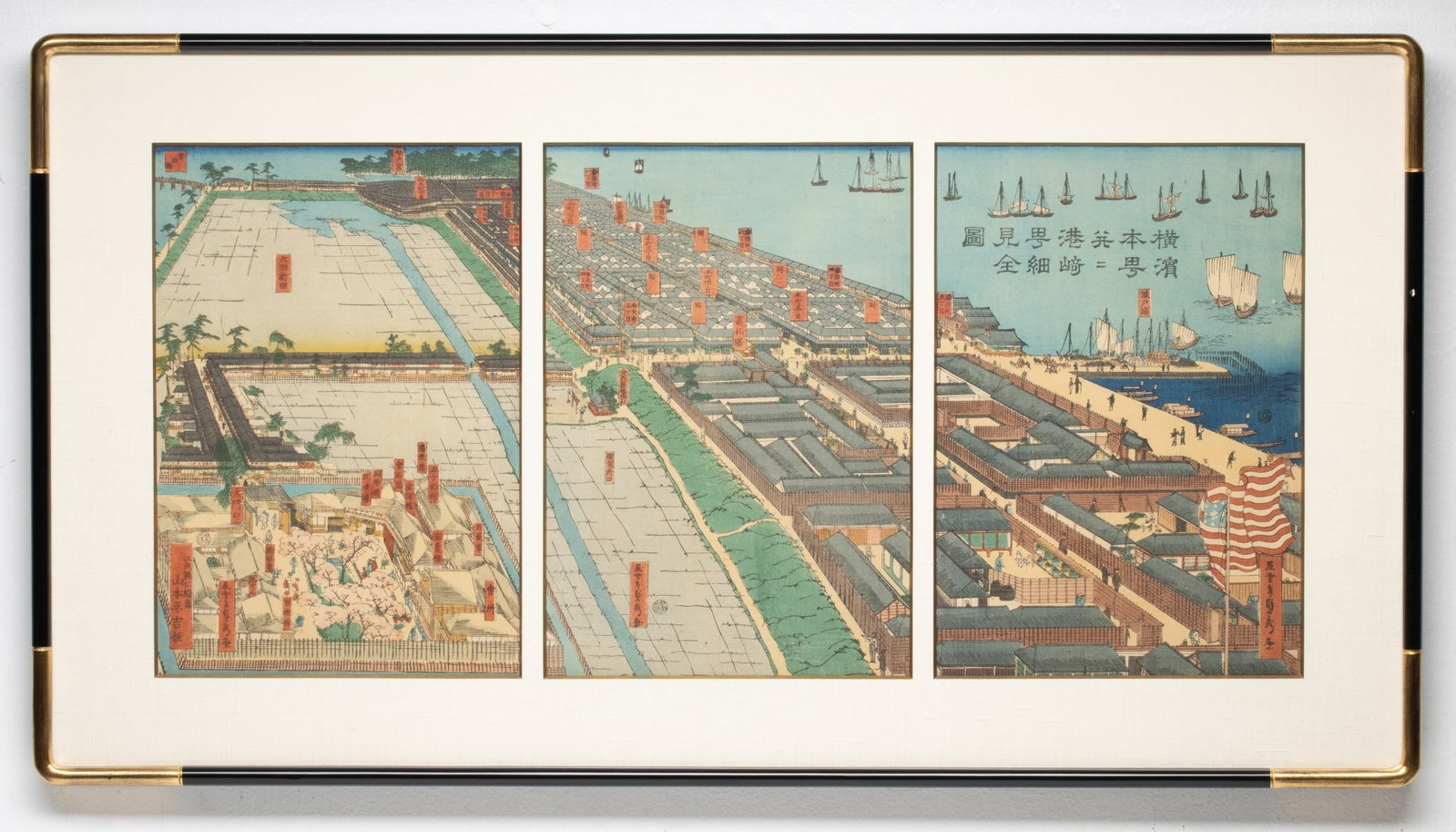A JAPANESE WOODBLOCK BIRDSEYE VIEW OF YOKAHAMA C. 1860: Utagawa Sadahide (1807-1879) Detailed View of Yokohama Honcho and Miyozaki Pleasure Quarters 1859-1860 The striking oban triptych bird's-eye view of Yokohama Port coincides with the aftermath of the
