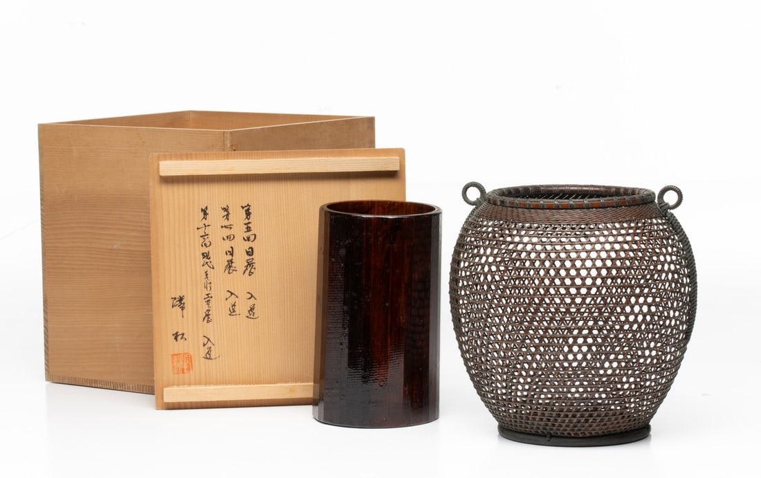AN ARTIST-SIGNED JAPANESE FLOWER BASKET, ADAIR ESTATE: The ovoid form is woven from bamboo using an exceptionally fine hexagonal plaiting technique braced by vertical and horizontal split bamboo stays, while the rim is tightly bound with split-cane wrap.