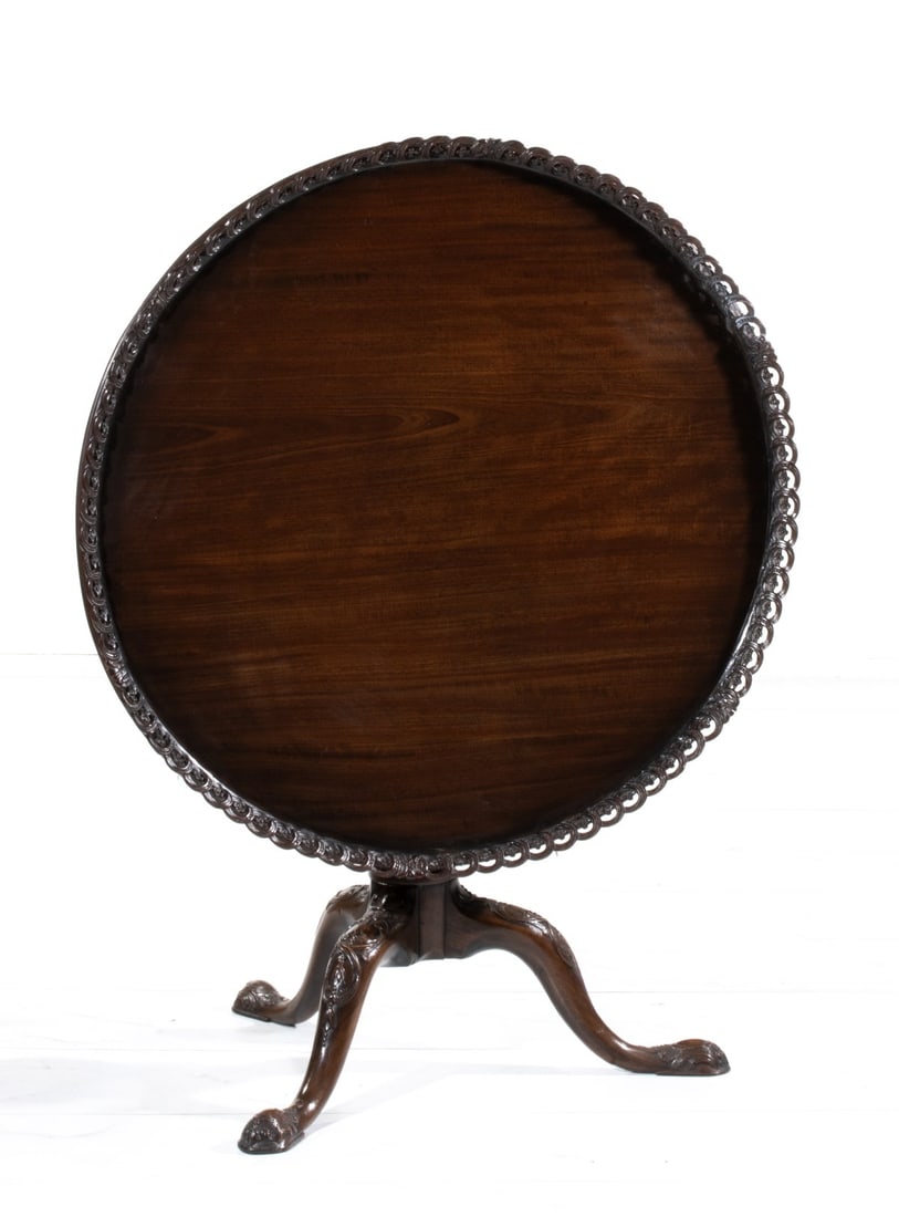 AN UNUSUAL MAHOGANY TABLE WITH PIERCED AND TILTING TOP (1 of 20)