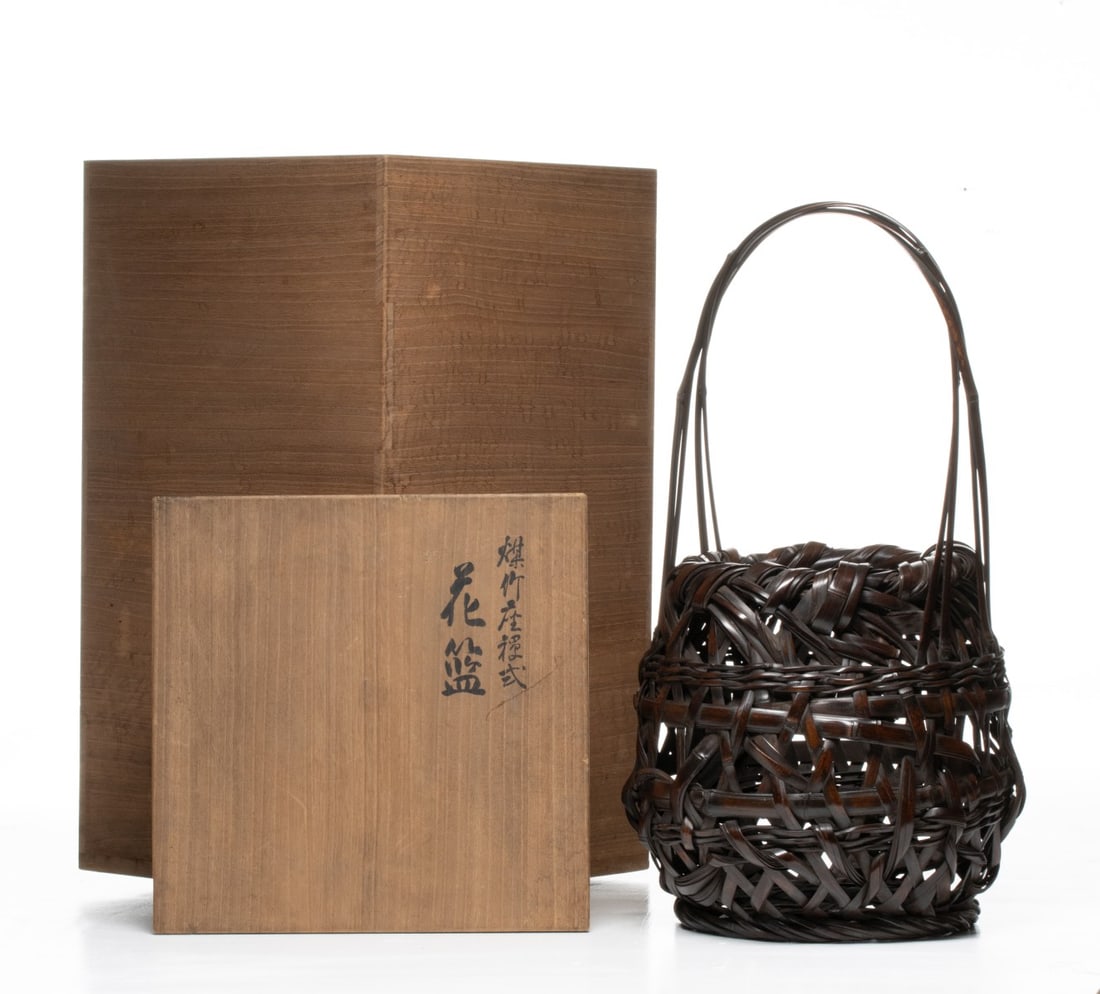 JAPANESE BASKET BY CHIKUUNSAI DATED 1922, ADAIR ESTATE: The robust globular form in 'disorderly weave' is constructed using thick, wide bamboo stalks that are intact with their natural nodules. The weaving follows a vigorous disordered pattern that creates