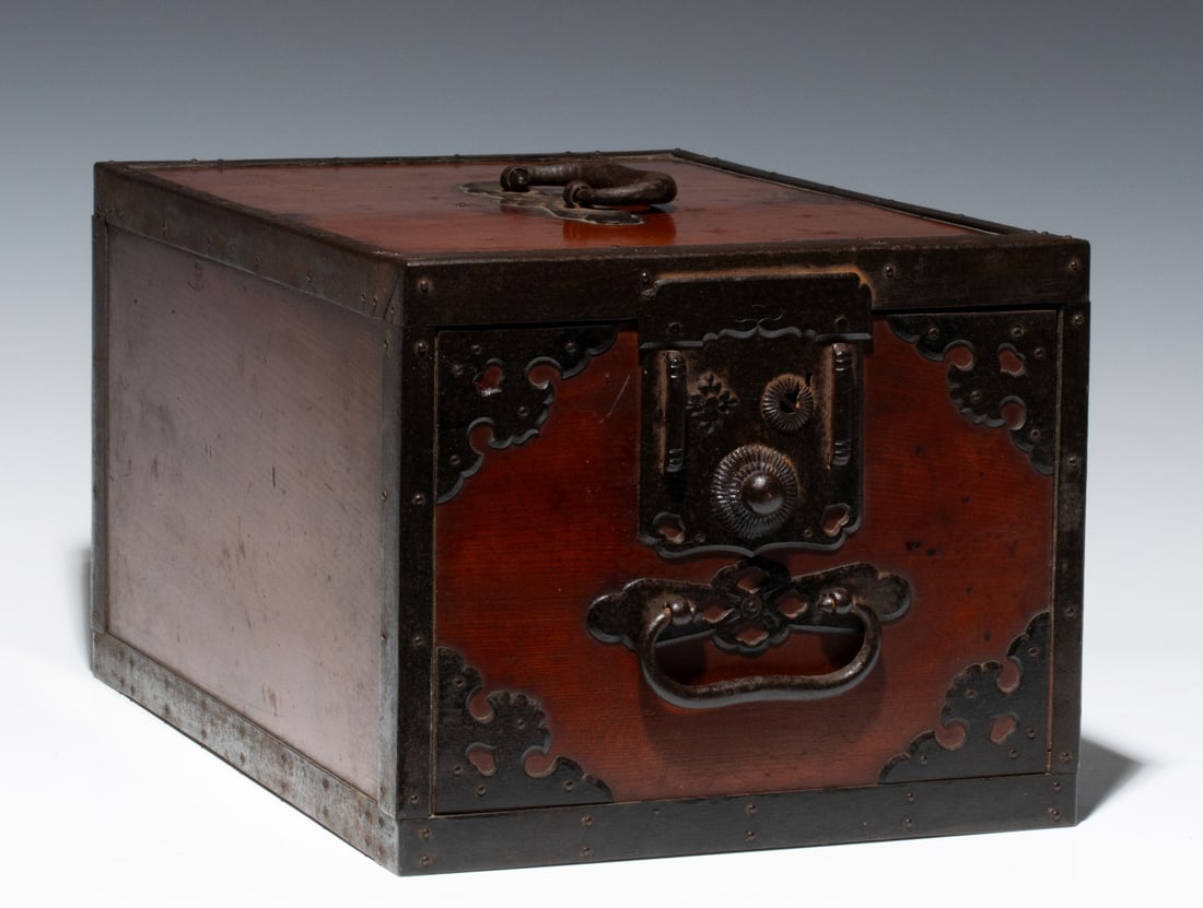 A MEIJI PERIOD JAPANESE STORAGE BOX WITH IRON MOUNTS: An iron bound keyaki wood box. Measures 8.25 x 10.25 x 15.5 inches. Provenance: The estate of John Adair Jr. (1942-2025), founder and proprietor of Kurofune Antiques in Tokyo (est. 1978), a world-reno