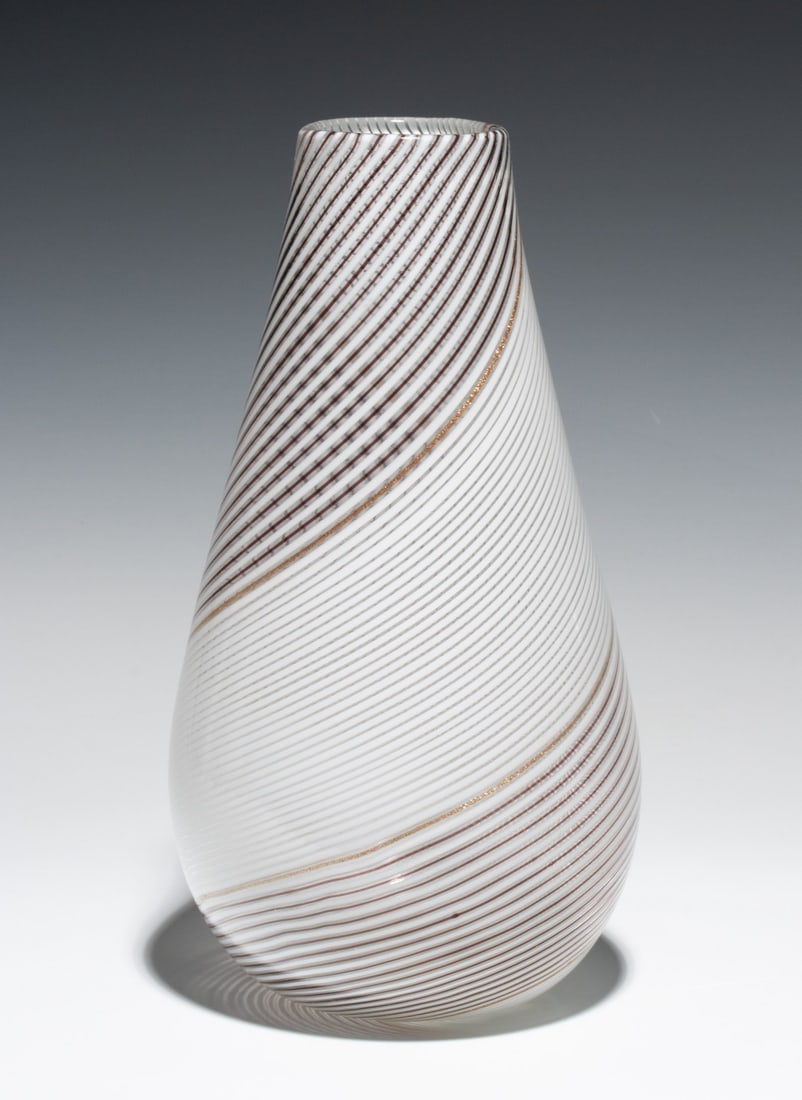 A DINO MARTENS MURANO 11.5 INCH FILIGRANA VASE FOR TOSO: Dino Martens (1894-1970) Filigrana Third quarter of the 20th century. The tapered ovoid form displays precise, fine-line internal decoration of white, aubergine and aventurine; polished pontil with