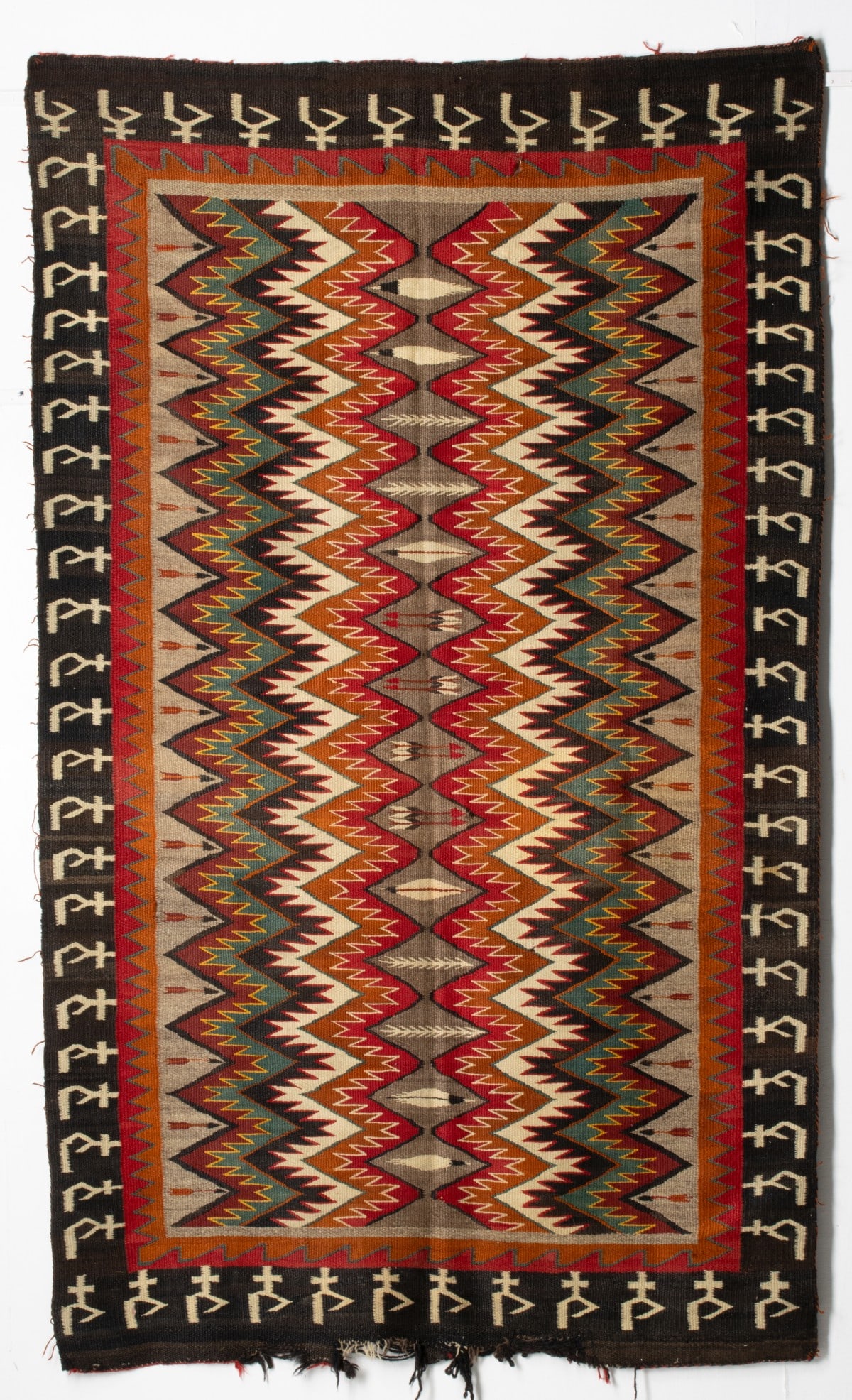 AN UNUSUAL RED MESA NAVAJO RUG WITH PICTORIAL ELEMENTS (1 of 20)