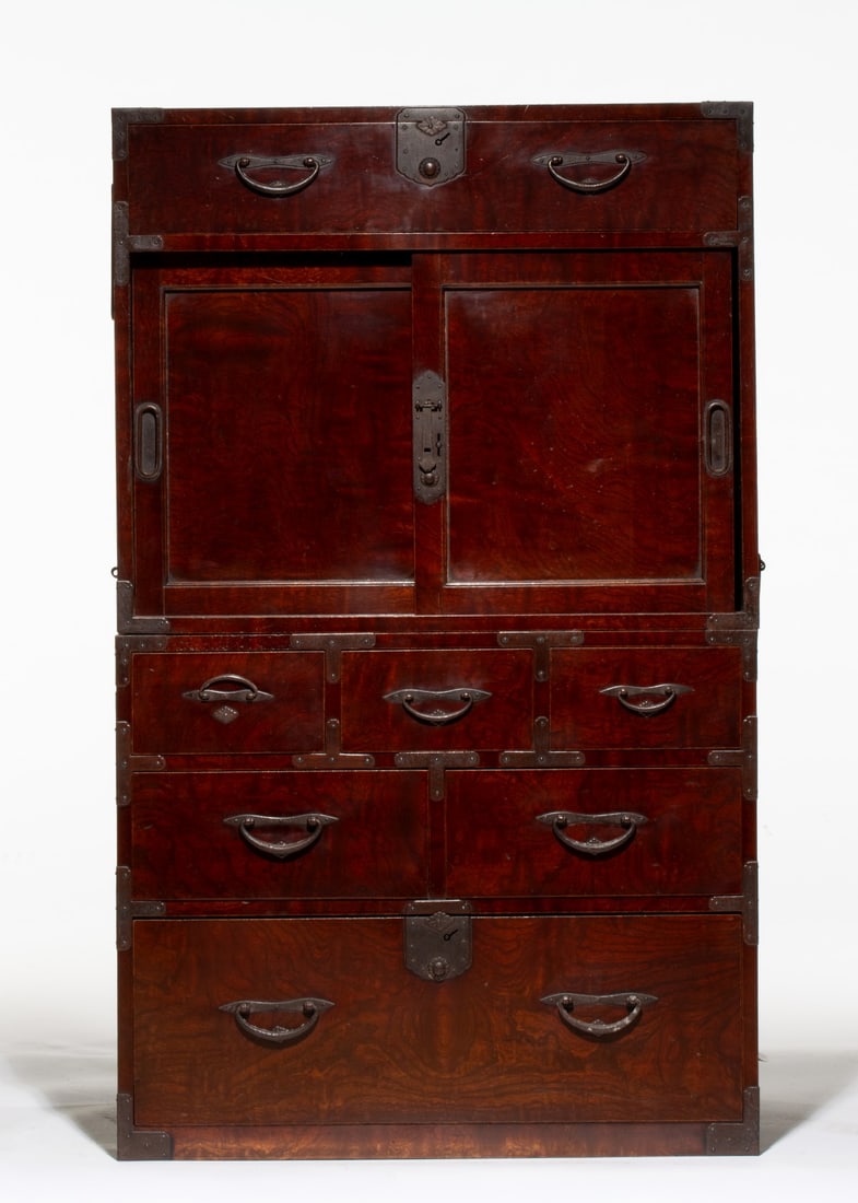 A MEIJI TWO-SECTION KEYAKI & CEDAR WOOD CLOTHING CHEST: The cedar sides and top of the cabinet is fronted by nicely patinated keyaki wood in a configuration of a long drawer over a sliding-door compartment above a tier of three small drawers over two large
