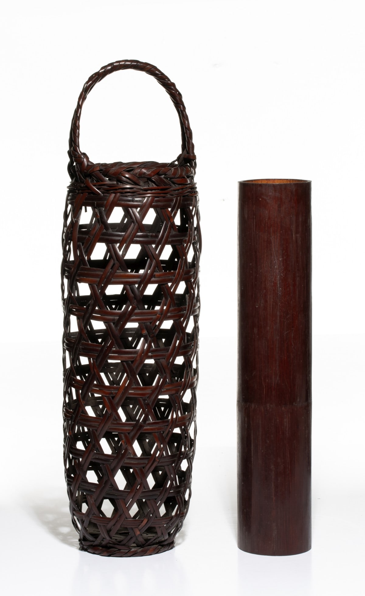 KOCHIKUSAI TALL JAPANESE IKEBANA BASKET, ADAIR ESTATE: The cylindrical body is constructed with an openwork hexagonal star-weave pattern using wide split bamboo strands reinforced with horizontal bands. The basket is topped with a thick, rolled-bundle rim