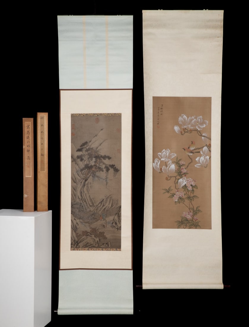 TWO EAST ASIAN HANGING SCROLLS IN THE STYLE OF MA YUAN: A pair of hanging scrolls comprising a classical Chinese-style landscape painted in ink and light color on silk, and a gongbi-style bird-and-flower painting depicting magnolias and small songbirds. 1.