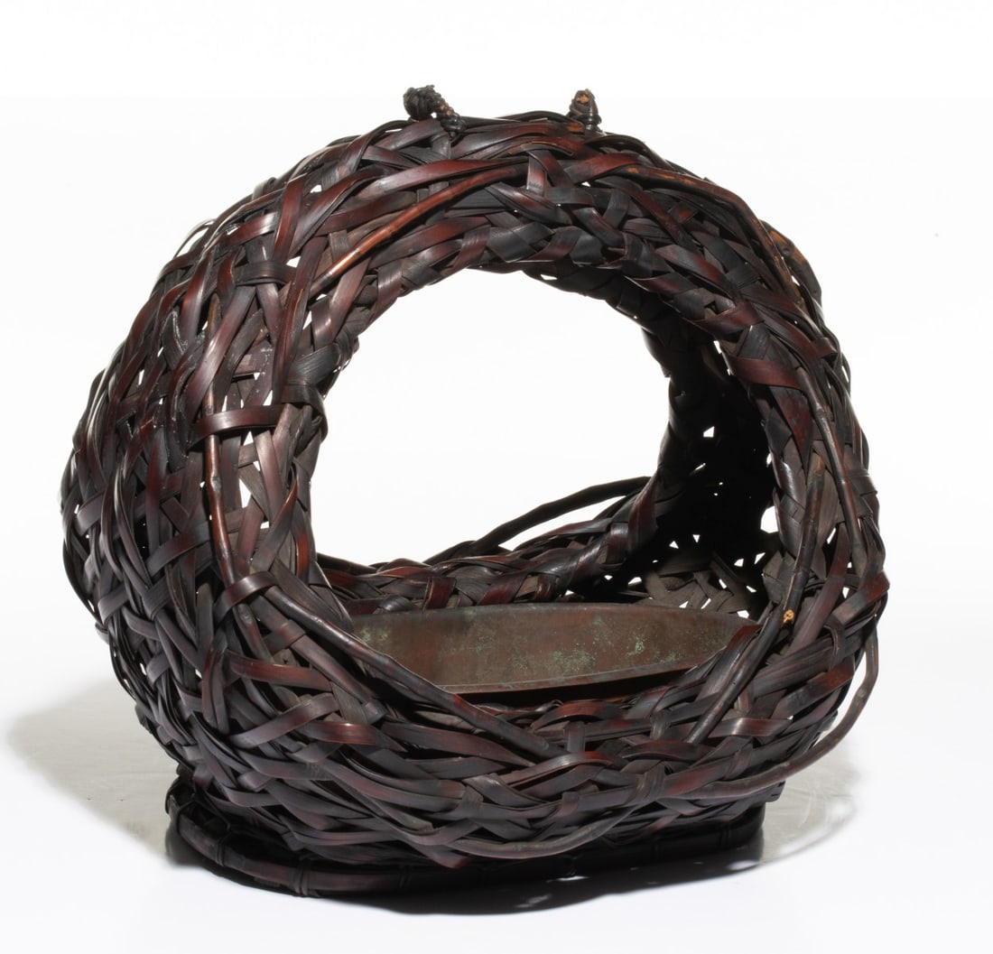 A MOON SHAPE JAPANESE IKEBANA BASKET, ADAIR ESTATE: The moon-shaped bamboo flower basket with ring-form body of full moon is crafted in an organic irregular openwork weave and found complete with its original fitted copper liner. The work is completed 