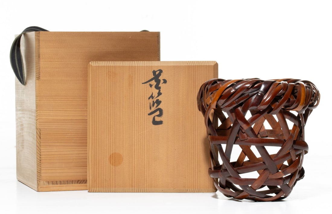 AN ARTIST SIGNED JAPANESE BAMBOO BASKET, ADAIR ESTATE: The flaring form in open plaiting is crafted from wide, thick strips of polished bamboo woven in a sweeping hexagonal openwork lattice beginning with a large heavily layered, looped rim and form that 