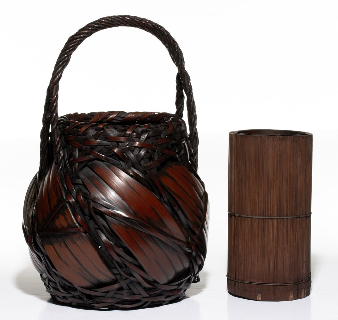 A JAPANESE FLOWER BASKET IN RANDOM WEAVES, ADAIR ESTATE: The bold and expressive example blends wide interlocking splints with a complex upper area of irregular, multi-directional openwork plaiting above the swelling body dominated by wide, curved bamboo sp