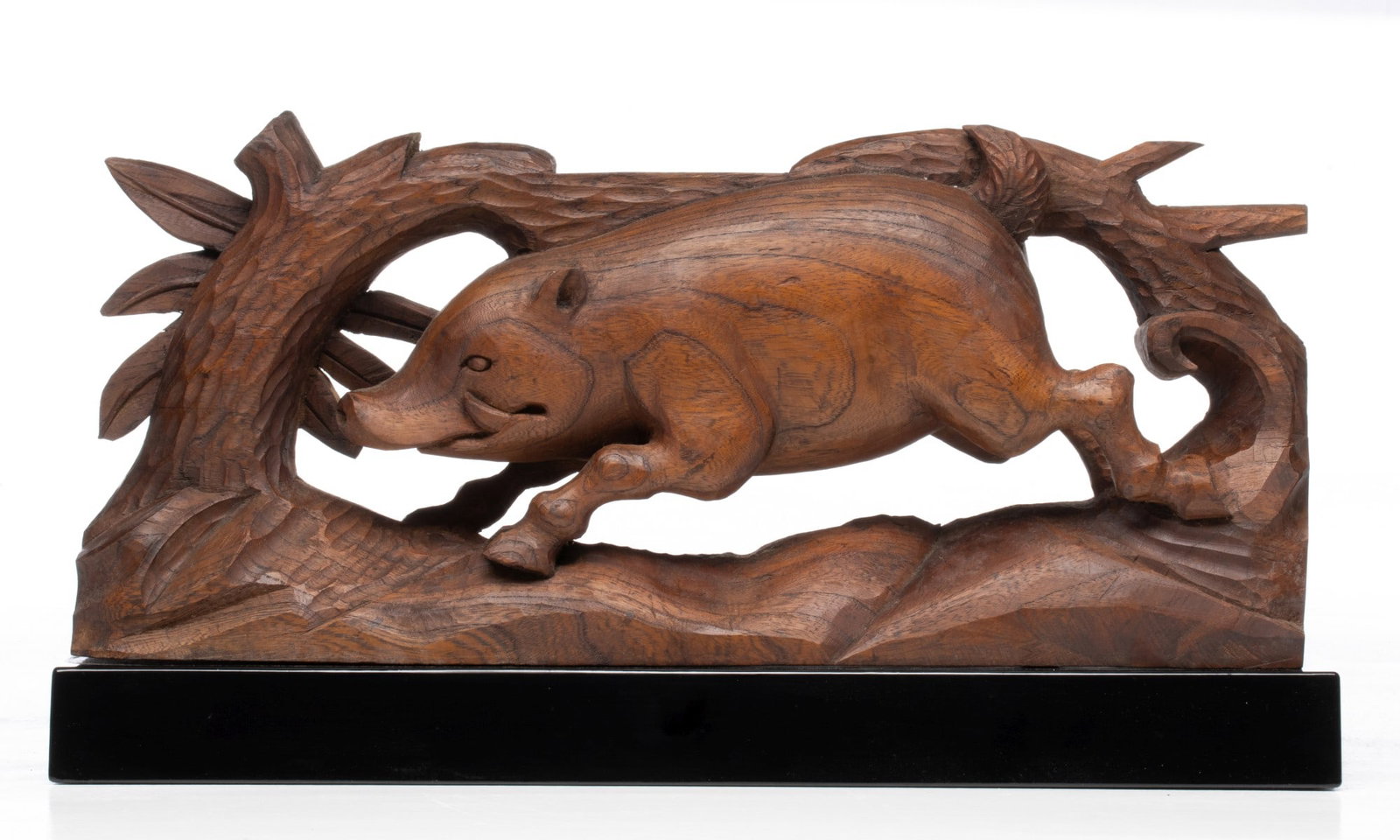 A JAPANESE CARVED KEYAKI WOOD SIGN OF THE ZODIAC: The unsigned, hand carved figure of a pig, one of the twelve animals of the Japanese zodiac, is displayed on a finely lacquered stand and accompanied by a fitted paulownia wood tomobako. Measures 9.5 