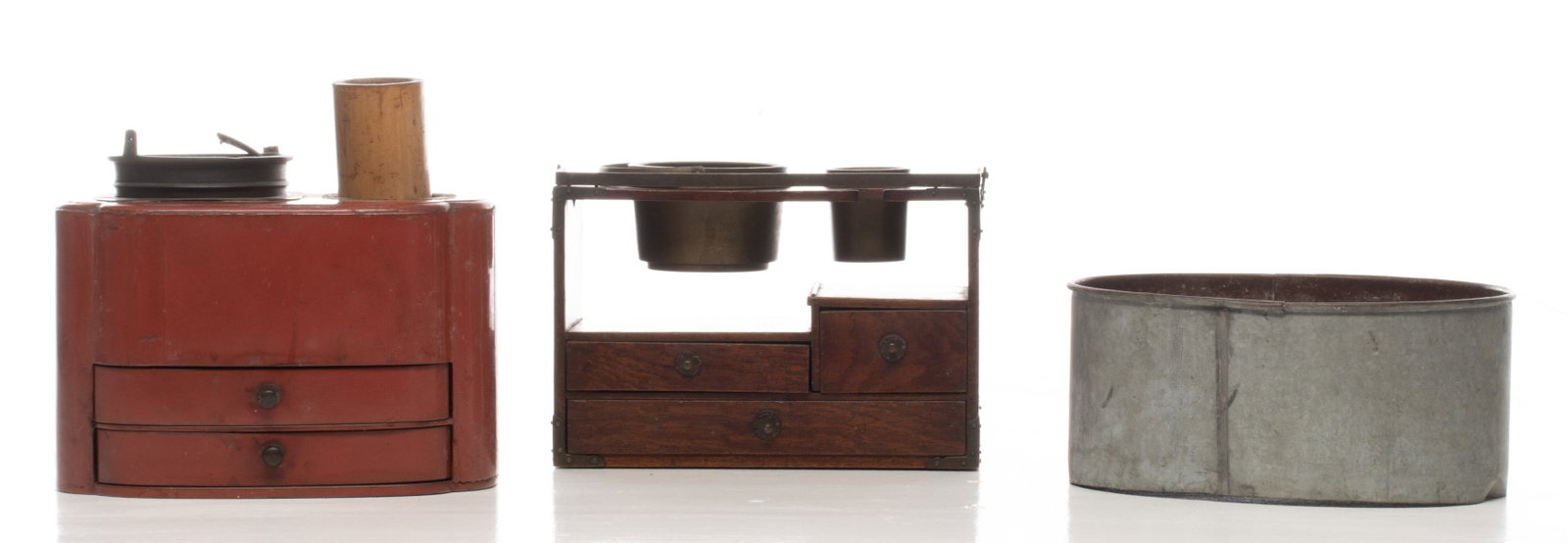 TWO JAPANESE GENTLEMAN'S SMOKING CABINETS: PLus an unassociated oval container. Sizes range from 4 x 9 x 7.25 to 8.25 x 9 x 5.75 inches. Provenance: The estate of John Adair Jr. (1942-2025), founder and proprietor of Kurofune Antiques in Tokyo