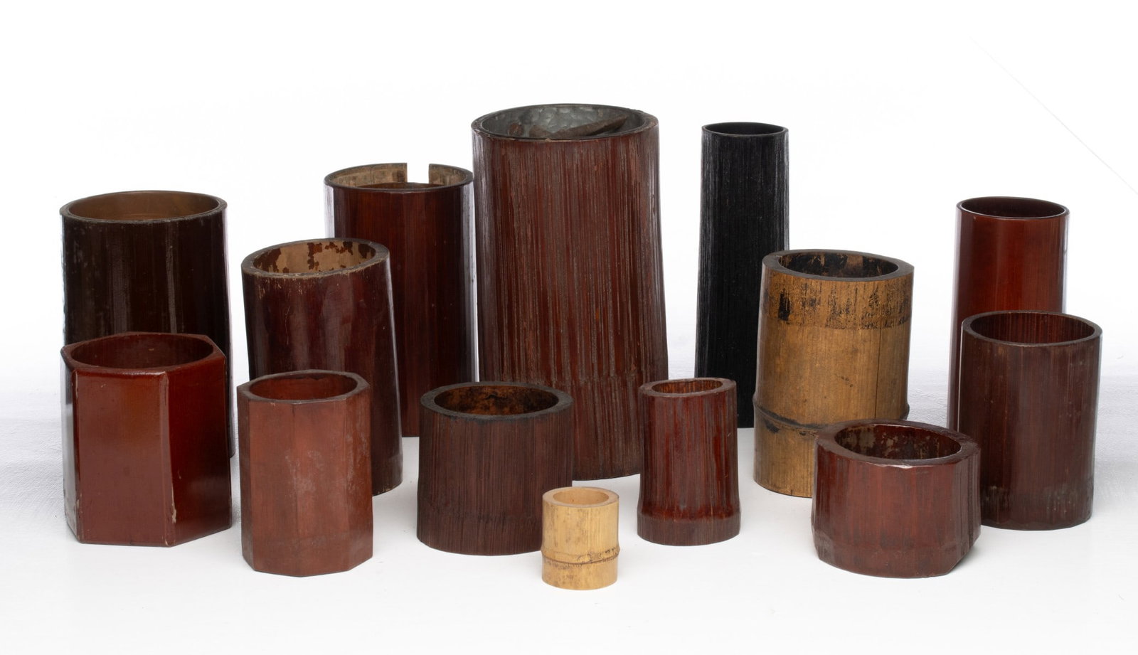 A COLLECTION OF JAPANESE IKEBANA BAMBOO CYLINDER VASES: Sizes range from 3 x 4.25 to 9.5 x 5.25 inches. Provenance: The estate of John Adair Jr. (1942-2025), founder and proprietor of Kurofune Antiques in Tokyo (est. 1978), a world-renowned destination for