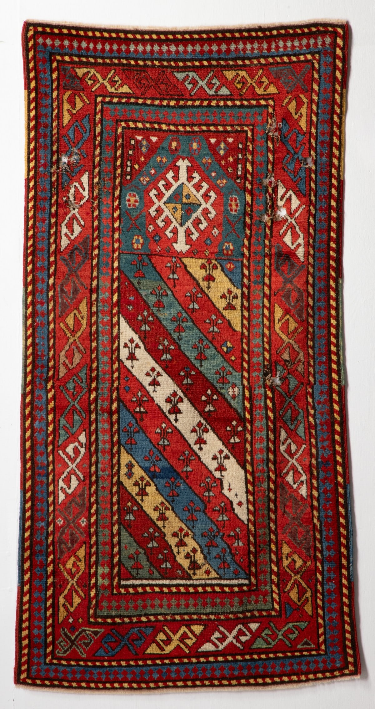 GENDJE PRAYER RUG, WEST CAUCASUS, CIRCA 1890. AS FOUND (1 of 17)