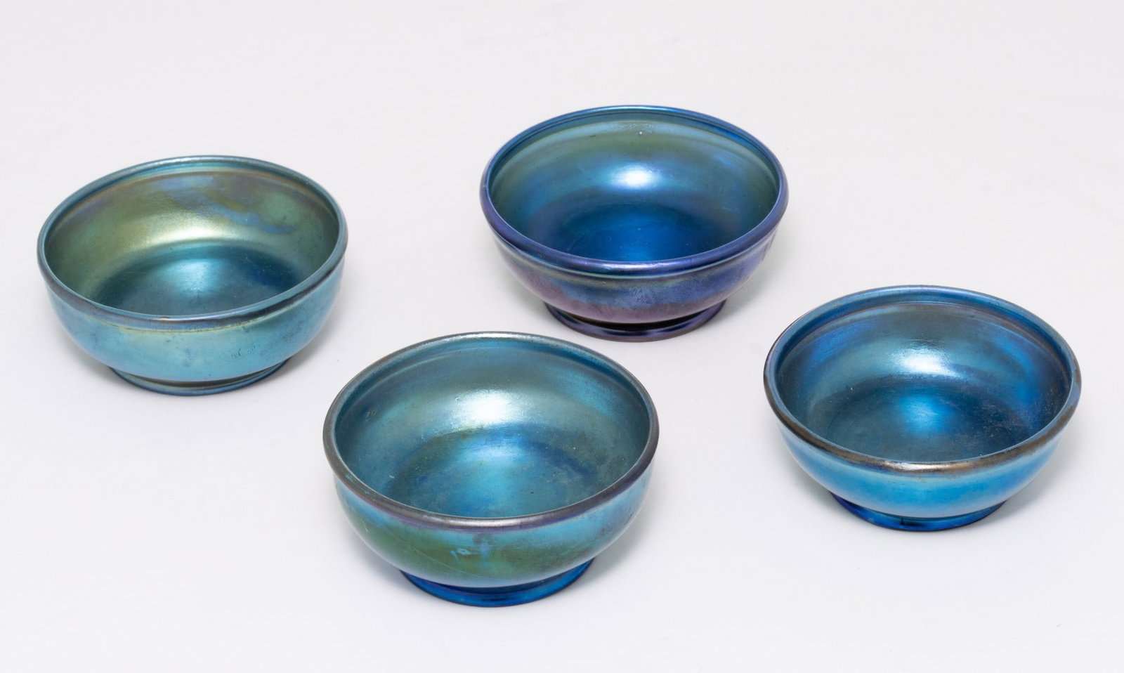 LOUIS COMFORT TIFFANY BLUE FAVRILE SALT CELLARS: Each signed on the polished rim. Each measures 1 x 2.75 inches in diameter. Without proof of exemption, be aware that internet sales tax applies to all Internet transactions and local sales tax may ap