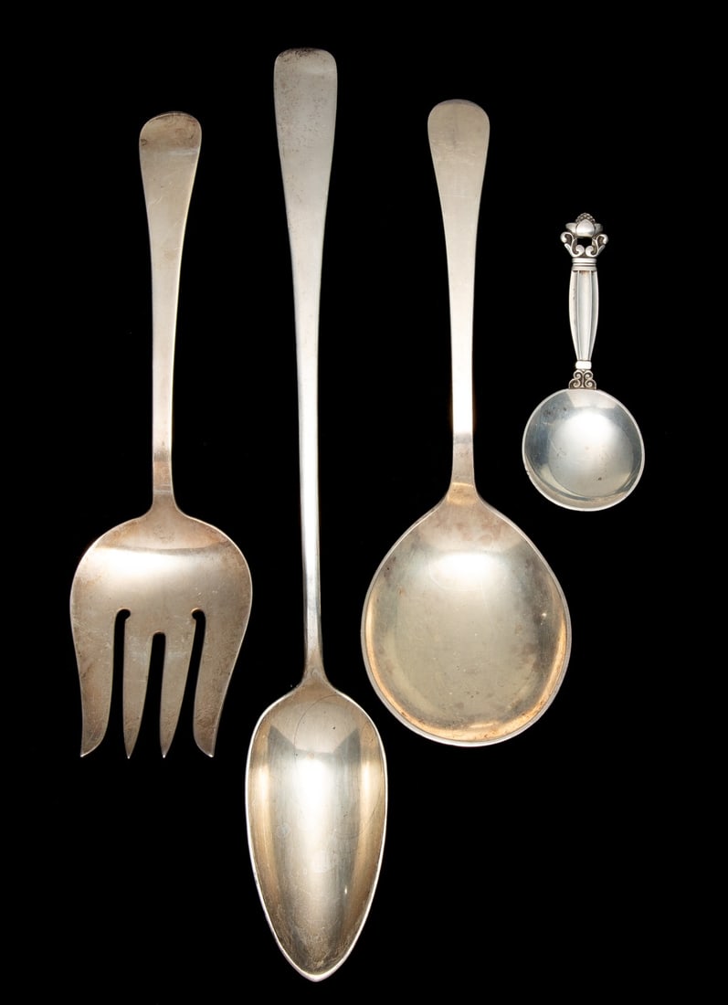 TUTTLE, ERICKSON AND JENSEN WORKSHOP STERLING SILVER: The group includes a Georg Jensen Acorn pattern nut spoon, an Erickson stuffing spoon type table spoon, and a serving set stamped with Tuttle Silversmith marks. Sizes range from 4 to 2 inches and