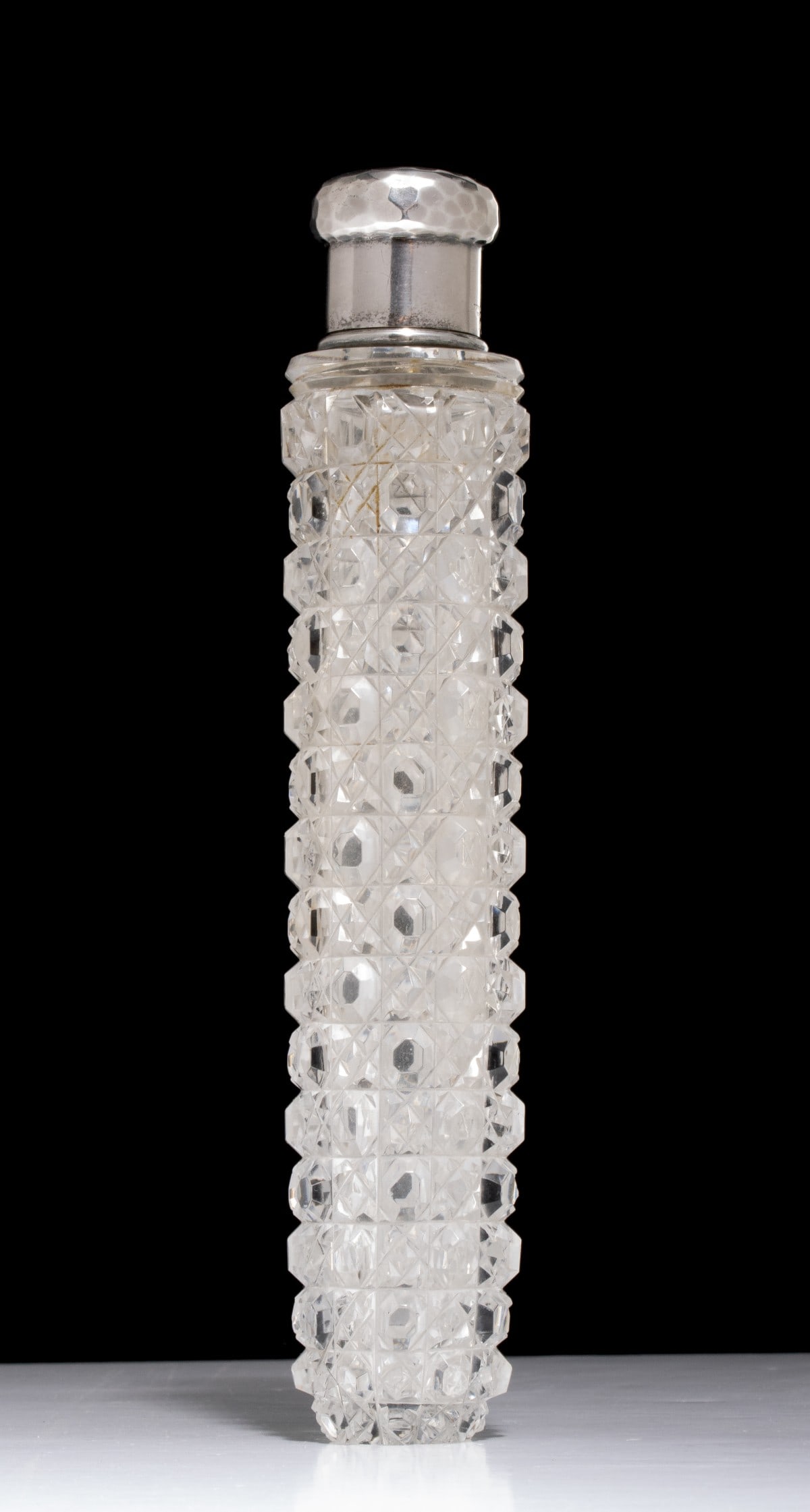 ABP CUT GLASS COLOGNE WITH STERLING SIGNED TIFFANY & CO: The fine cut glass bottle is signed Tiffany & Co. on the hammered sterling silver mount and bears the capital letter M stamp which dates the work to before 1891 when Edward C. Moore's tenure as the
