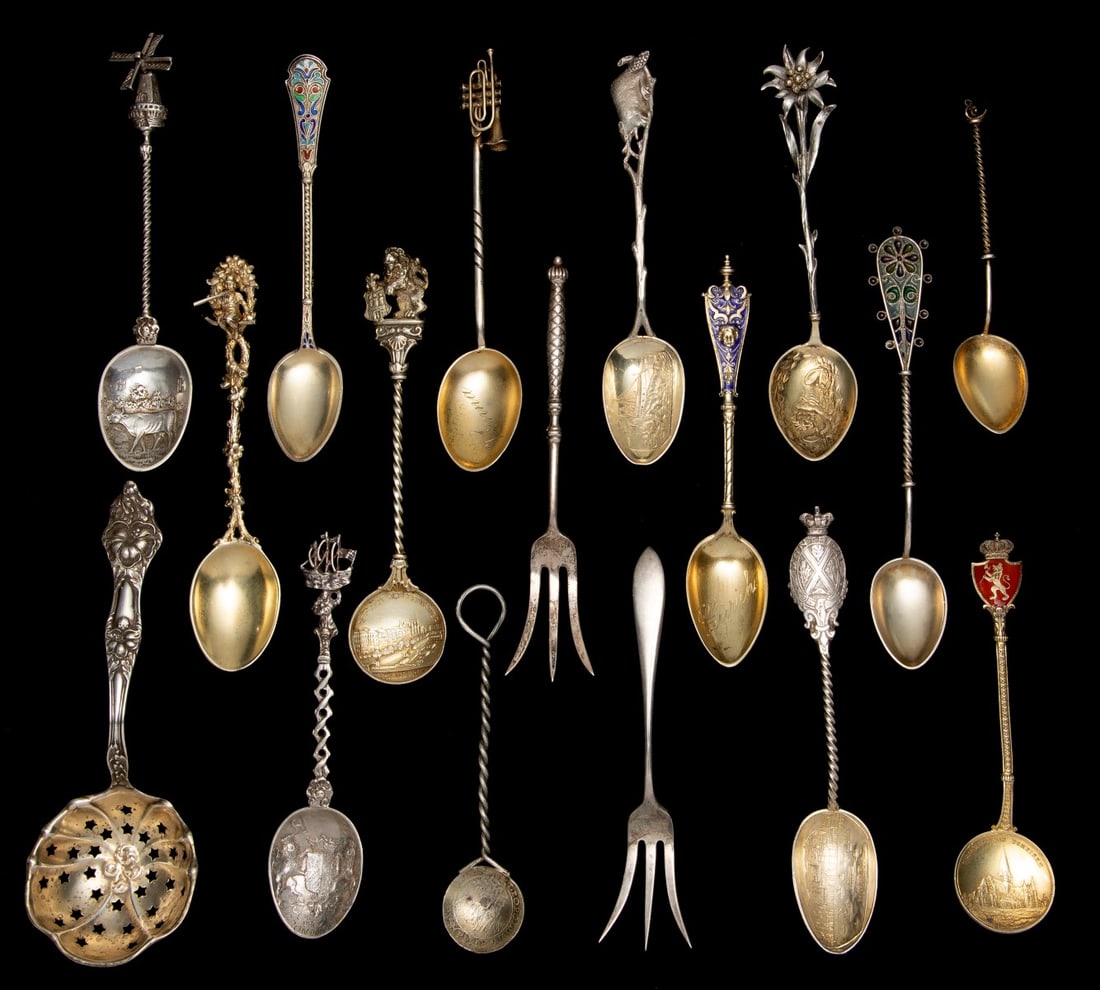 PLIQUE A JOUR, CHAMPLEVE' & OTHER FINE SILVER SPOONS: The fine collection includes sterling and 800 silver examples with gold wash. pictorial bowls, finely detailed figural handles, enamel techniques and other features. Sizes range from 3.75 to 5.25