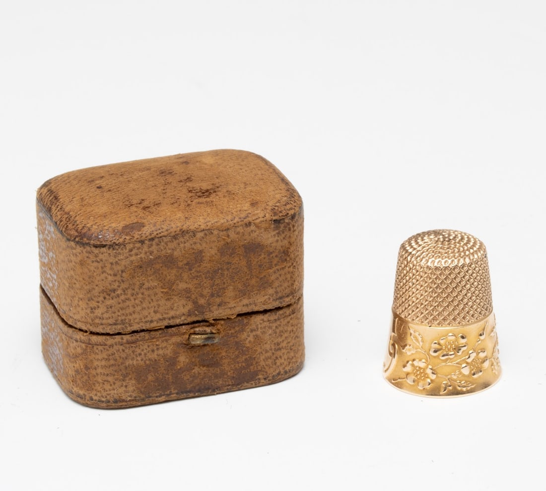 AN EDWARDIAN 14K GOLD SEWING THIMBLE: Stamped 14k inside the dome. Measures 0.75 tall with a weight of 5.5 grams. Without proof of exemption, be aware that internet sales tax applies to all Internet transactions and local sales tax may