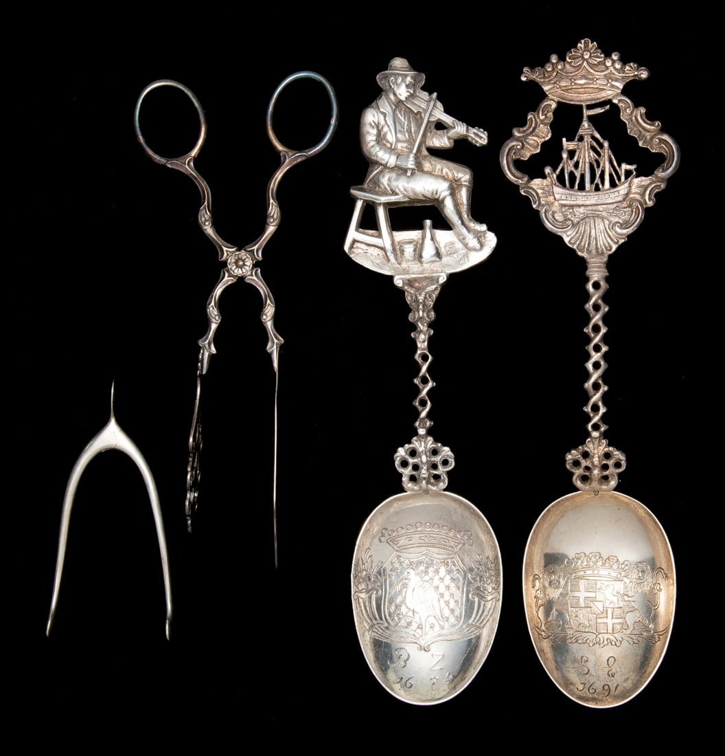 STERLING AND .800 SILVER NOVELTY ITEMS: Including Gorham spring-action tongs in the form of a wishbone, two Dutch-style 800 silver spoons, and an ornate silverplate server. Size range from 3.25 to 8.5 inches and weighs 6.55 ozt. Without