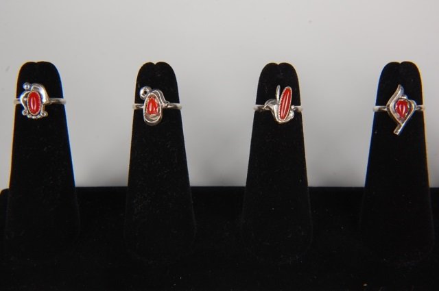 FOUR CARNELIAN RINGS BY BELL TRADING POST, SZ 4: With carnelian cabochons, unsigned. Ring size 4. Designs measure from .325 to .625 inches.