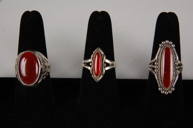 THREE CARNELIAN & STERLING RINGS BY BELL: Carnelian gem stones in sterling silver settings, all are signed with the Bell Trading Post logo and marked sterling. Sizes 9 and 9.5.