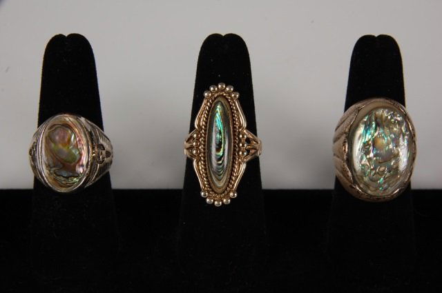 THREE ABALONE & STERLING RINGS BY BELL: Abalone gem stones, two in sterling silver settings and one in 12k gold-filled, all are signed with the Bell Trading Post logo and marked sterling or 12K GF. Sizes 8.5 and 9.