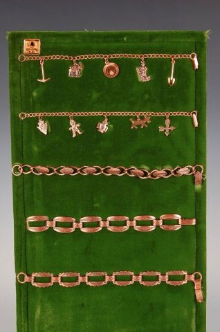 FIVE LINK & CHARM COPPER BRACELETS BY BELL: Three vintage Southwest copper bracelets and two charm bracelets with prospecting and Southwestern designs, unmarked. Measure 6.75 to 7.5 inches.