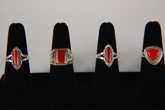 FOUR CARNELIAN & STERLING RINGS BY BELL, SZ 8.5: Four sterling silver rings with carnelian cabochon stones, all are signed with the Bell Trading Post logo and marked sterling. Size 8.5.