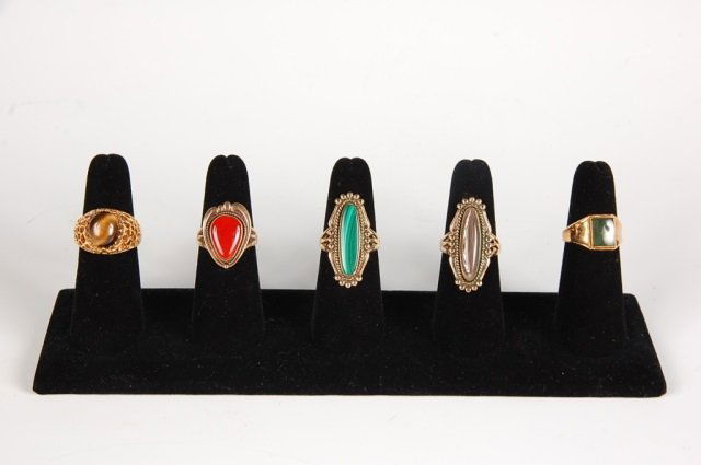 FIVE SEMI PRECIOUS RINGS BY BELL, SZ 8.5 TO 9: One each of malachite, tiger eye, abalone, green jade and carnelian semi precious stone rings. Abalone, malachite and carnelian rings are signed with the Bell Trading Post logo and marked 12KT gold-fi
