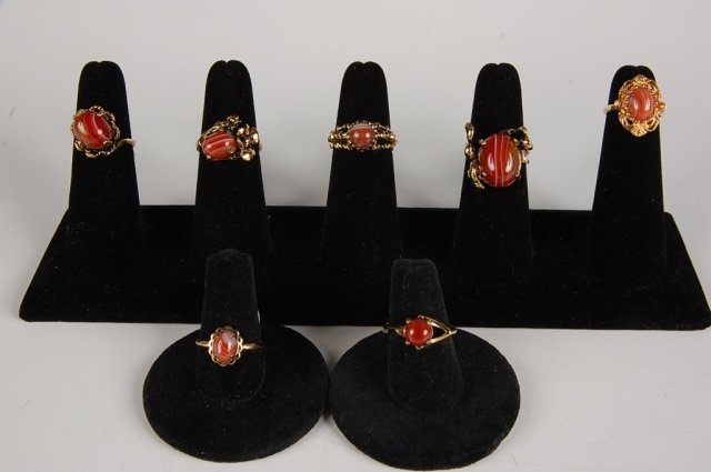 SEVEN BANDED AGATE RINGS BY BELL, SZ 4.5 to 7: Banded agate rings, one is marked 14KT HGE for heavy gold electroplate, the rest are unmarked. Sizes 4.5 to 7.