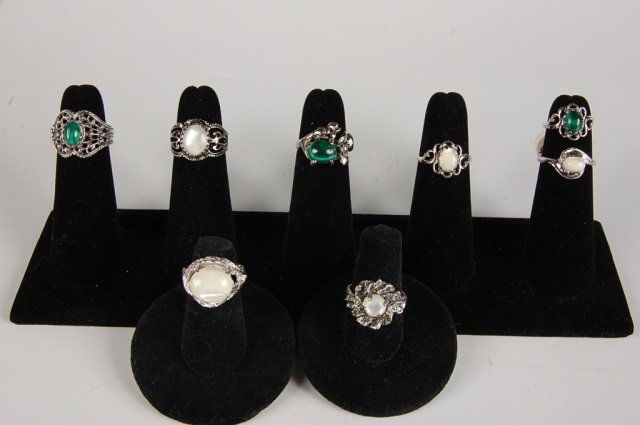 EIGHT MOONSTONE & THREE MALACHITE RINGS, SZ 4-6: Five moonstone rings, unmarked and three malachite rings, one marked 18KT HGE for heavy gold electroplate. Sizes 4 to 6.