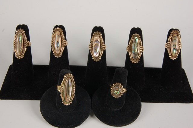 SEVEN ABALONE RINGS BY BELL TRADING POST, SZ 5-6: Seven abalone rings in gold-filled settings, marked 12KT GF and signed with the Bell Trading Post logo. Sizes 5 to 6.